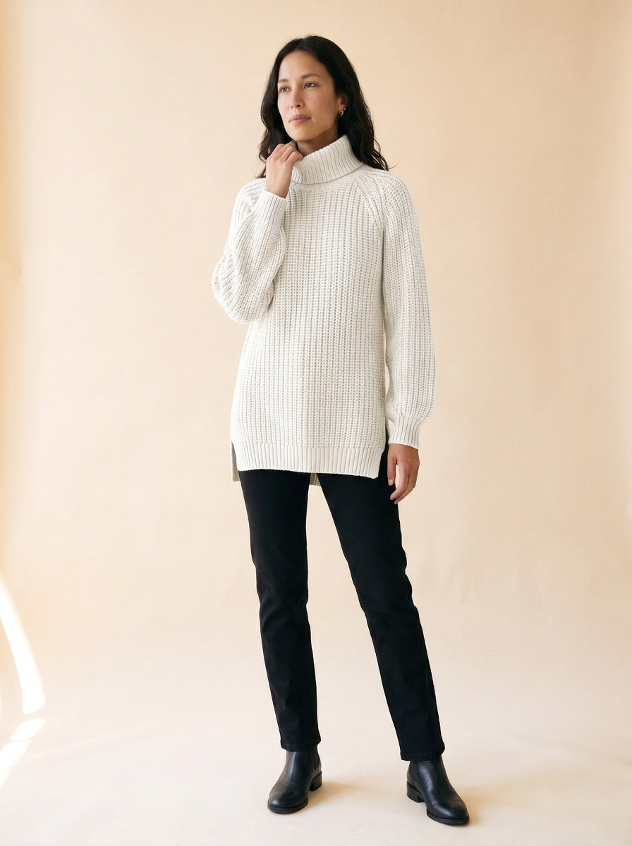 Women's Split-Hem Turtleneck Sweater in White - model