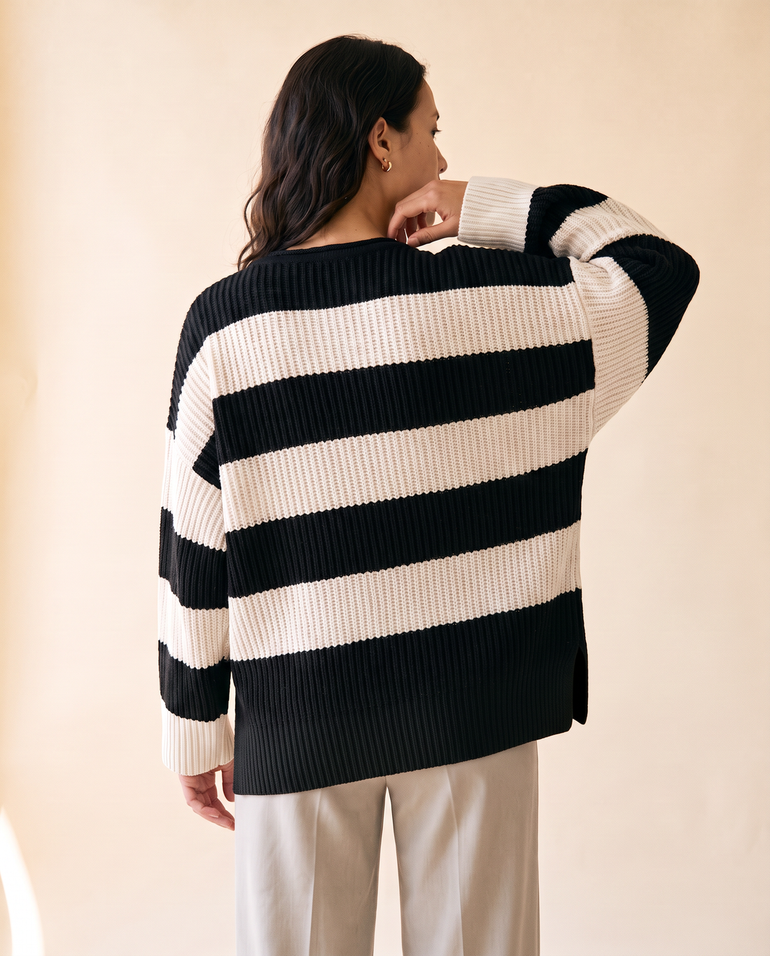 Women's Oversized Striped Batwing Sweater in Black - model second view