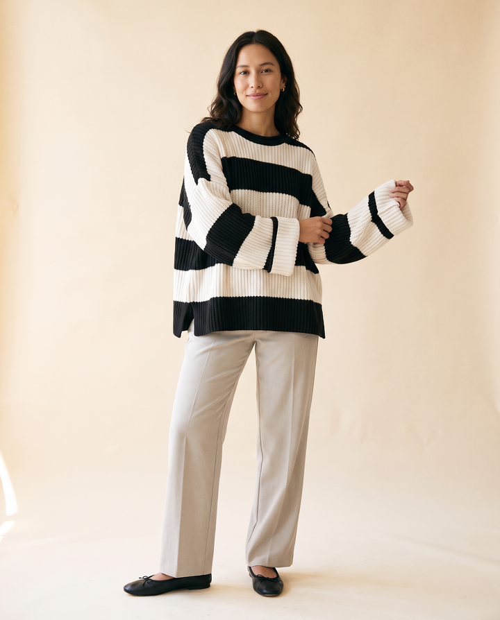 Women's Oversized Striped Batwing Sweater in Black - model front view